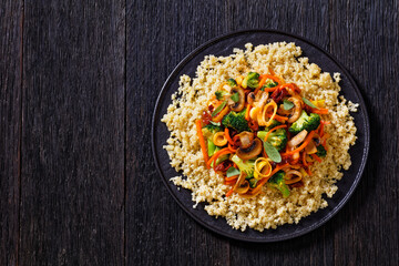 quinoa with fried veggies, mushrooms on plate
