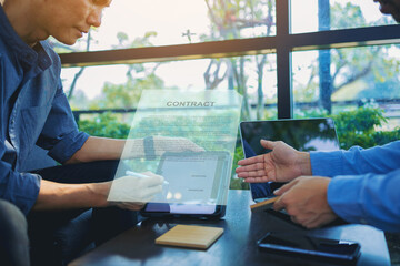 Businessman with digital pencil to puts signature on digital electronic contract in digital tablet....