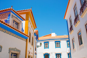 Fototapeta na wymiar colorful houses and streets of sunny cozy Ericeira
