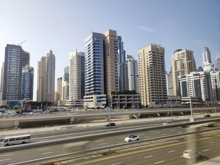 Dubai, UAE- March 31 2022: Residential apartments and commercial offices in the downtown next to the highway.