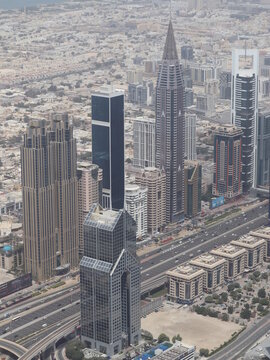 Dubai, UAE- March 31 2022: Multiple large buildings and skyscrapers surrounding central district skyline of the downtown urban city.