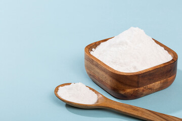 Bowl With Baking Soda; Photo Blue Background