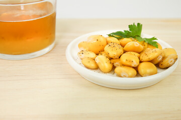Spanish Tapa of Lupin Beans next to cold beer