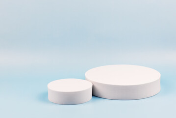 White round podium on light blue background