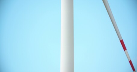 Windmill spinning against sky