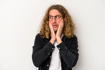 Young caucasian man isolated on white background scared and afraid.