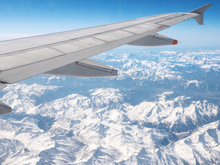 Airplane wing. View from plane window. Travel and transport concept