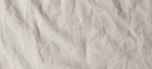 Naklejka na ściany i meble Abstract linen fabric texture background. Crumpled off white natural linen organic eco textiles canvas background. Top view