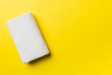 Top view of white towels with copy space on colored background