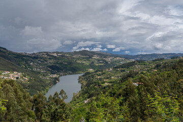 Fototapeta premium view of the Douro River and Valley under an overcast sky after a spring rain shower
