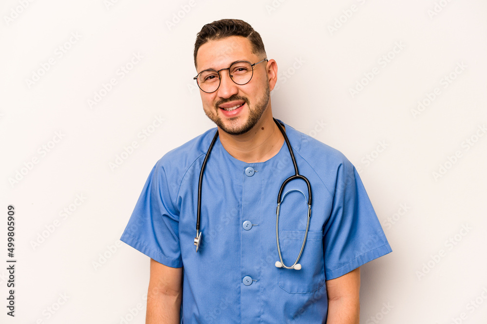 Wall mural Hispanic nurse man isolated on white background happy, smiling and cheerful.