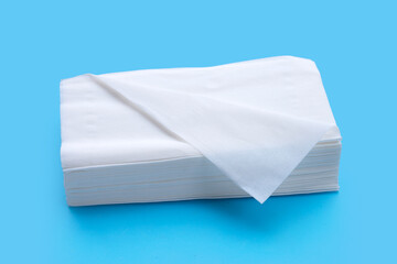 Facial tissue on blue background.