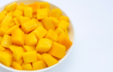 Tropical fruit, Mango cube slices in white plate on white background.