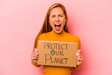 Young caucasian woman holding protect our planet placard isolated on pink background