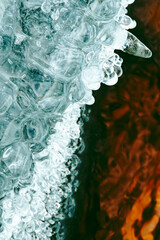 Turquoise ice with droplets and texture cracks as background