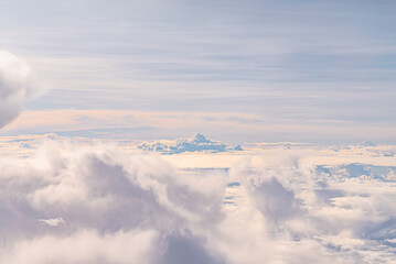 View over the clouds above Tanzania. Bright skyscape