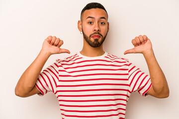 Young hispanic man isolated on white background feels proud and self confident, example to follow.