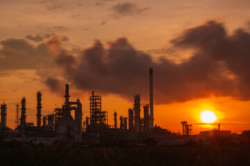 Fototapeta na wymiar Oil​ refinery​ and​ plant and tower column of Petrochemistry industry in pipeline oil​ and​ gas​ ​industrial with​ cloud​ slowing red sky
