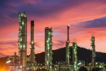 Oil​ refinery​ and​ plant and tower column of Petrochemistry industry in oil​ and​ gas​ ​industrial with​ cloud​ red​ ​sky the evening​ sunset
