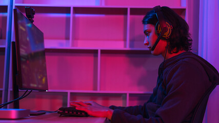 Game stream concept, Male streamer wear headset to play games online for streaming on social media