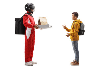 Delivery man with a helmet delivering pizza and food to a schoolboy