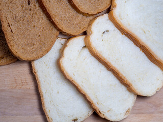 Sliced ​​bread for breakfast. Food on the table. Flour products. Pieces of bun.