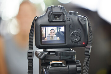 Have a vision. Shot of a young woman using a camera to record for her vlog in a gym.