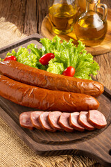 Raw smoked sausage on the table. Calabrese sausage.