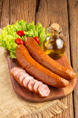Raw smoked sausage on the table. Calabrese sausage.