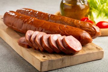 Raw smoked sausage on the table. Calabrese sausage.