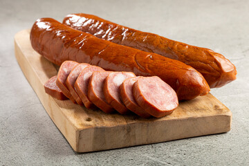 Raw smoked sausage on the table. Calabrese sausage.