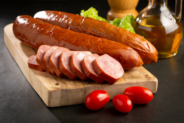 Raw smoked sausage on the table. Calabrese sausage.