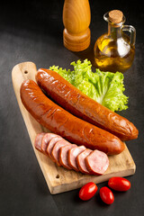 Raw smoked sausage on the table. Calabrese sausage.