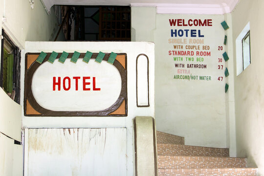 The Entrance To The Cheap Hotel. Budget Hotel With An Empty Staircase. Hotel For Backpackers.