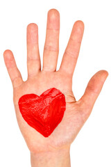 Obraz premium Hand with painted red heart
