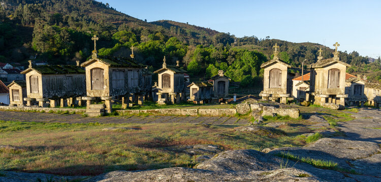 morning light over granaries and stone storage sheds in the village of Lindoso in Portugal