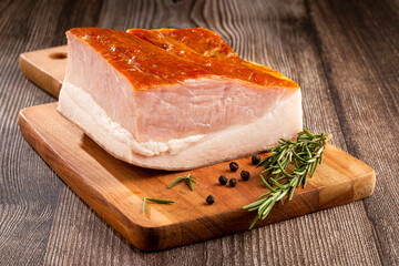 Sliced ​​raw bacon on the table.