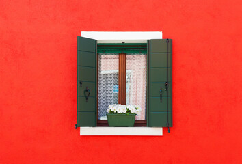 Obraz premium Colorful wall and window of residential house in Burano island, Venice, Italy