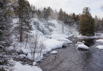 Frozen winter waterfall on river
