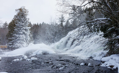 Frozen winter waterfall on river