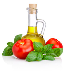 Bottle of olive oil and tomatoes with leaves basil isolated on white background
