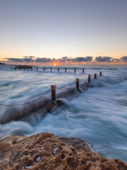 Sunrise view of Maroubra rock pool in high tide, Sydney, Australia.