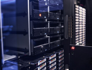 All your data, safe and secure. Cropped shot of a large, dark and empty server room.