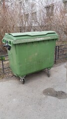 plastic trash can on the street on a sunny morning