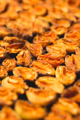 The process of home cooking dried fruits in an electric dryer.