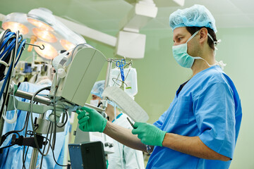 Surgery assistant perfusionist at modern heart lung machine - obrazy, fototapety, plakaty