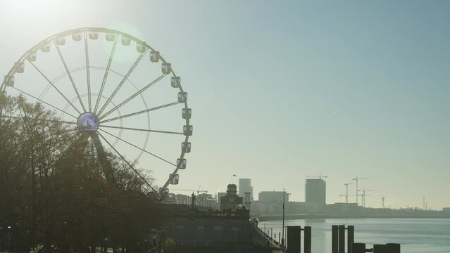 Ferris wheel in Antwerp Belgium with morning light for tourists