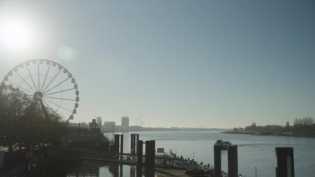 River Harbor with Ferris wheel in Antwerp Belgium tourism 4k 60p