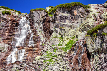 Fototapeta Waterfall and rocky mountains. obraz