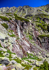 Waterfall and rocky mountains. © Jaroslav Moravcik